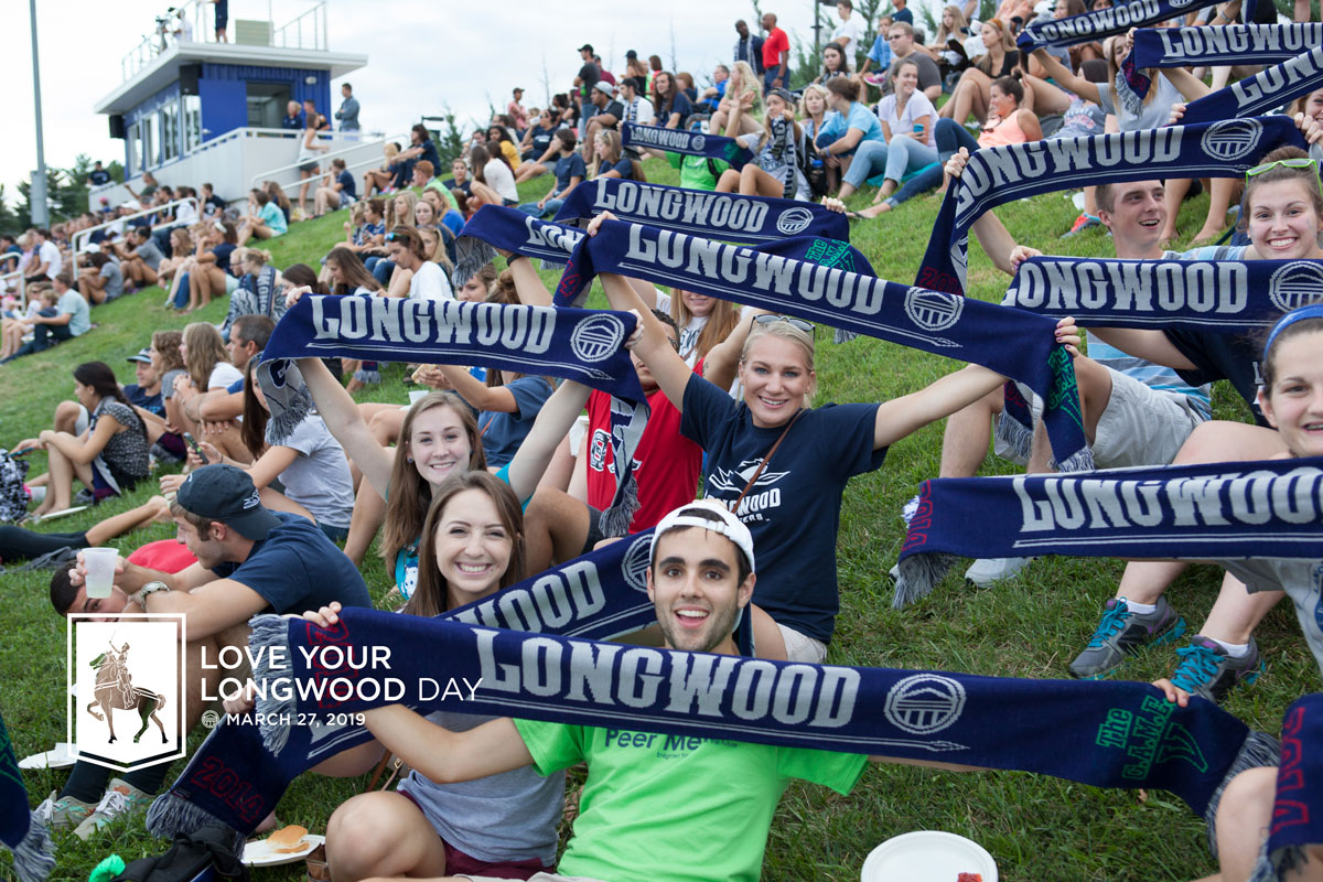 Students holding up their Longwood scarves. Love Your Longwood Day background image